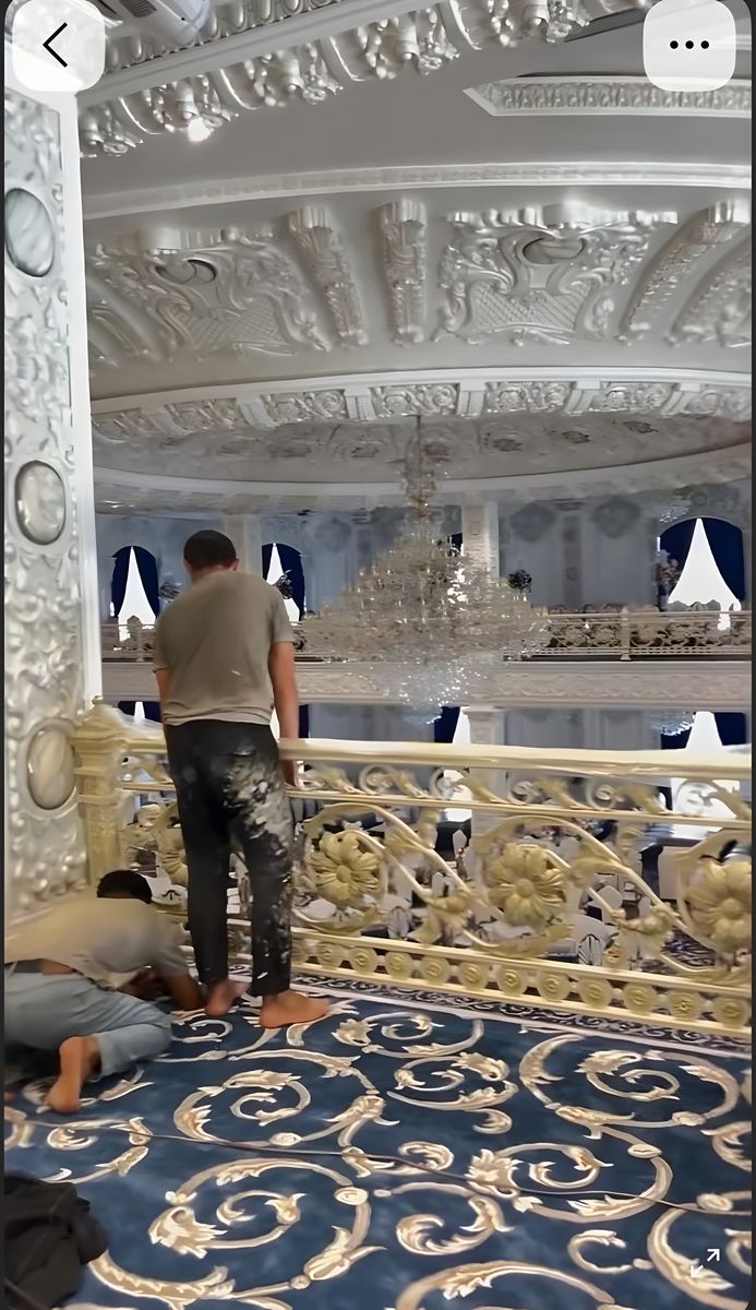 Carved ceiling panels being fitted on site